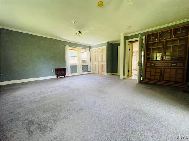 62 Pleasant Valley Rd, Groton, NY 13073 - unfurnished living room with crown molding, baseboards, and carpet