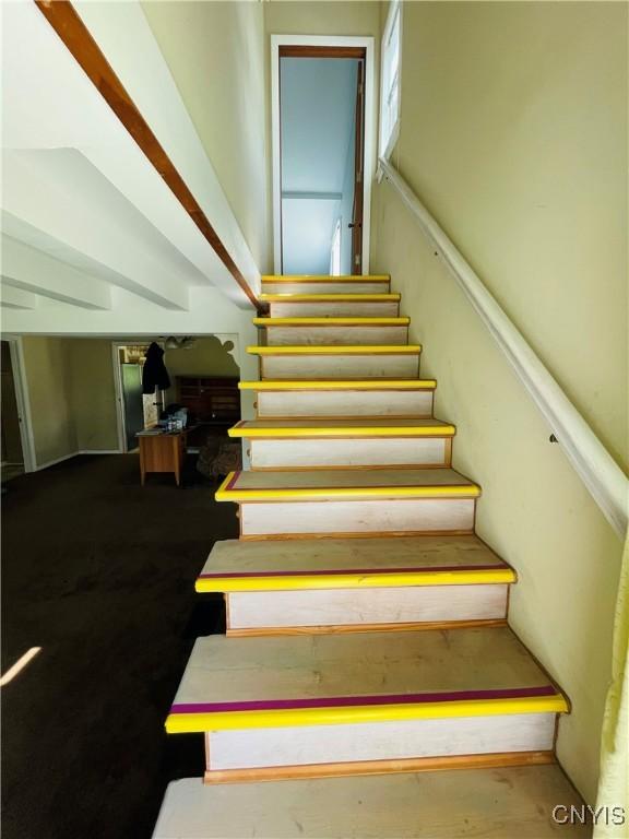 62 Pleasant Valley Rd, Groton, NY 13073 - stairway featuring lofted ceiling