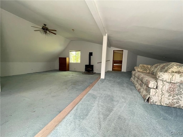 62 Pleasant Valley Rd, Groton, NY 13073 - additional living space featuring carpet flooring, vaulted ceiling, a wood stove, and ceiling fan