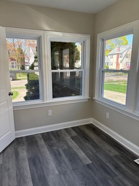 34 Sunnyside Dr, Elmira, NY 14905 - unfurnished dining area featuring dark wood finished floors and baseboards