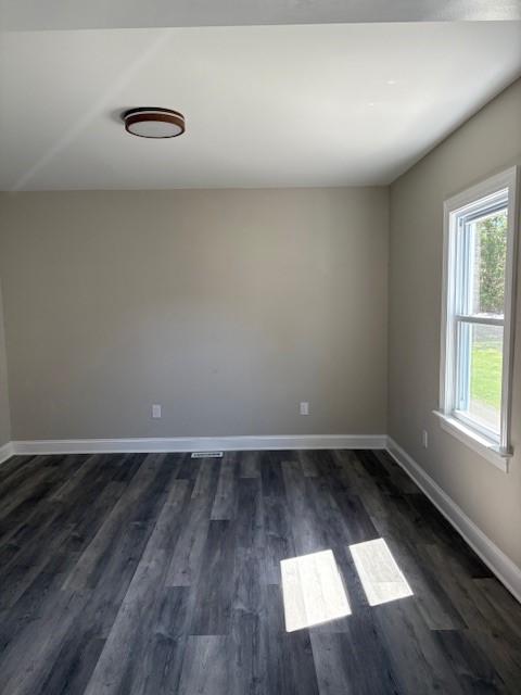 34 Sunnyside Dr, Elmira, NY 14905 - unfurnished room featuring baseboards and dark wood finished floors