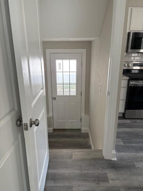 34 Sunnyside Dr, Elmira, NY 14905 - doorway to outside with dark wood-type flooring and baseboards