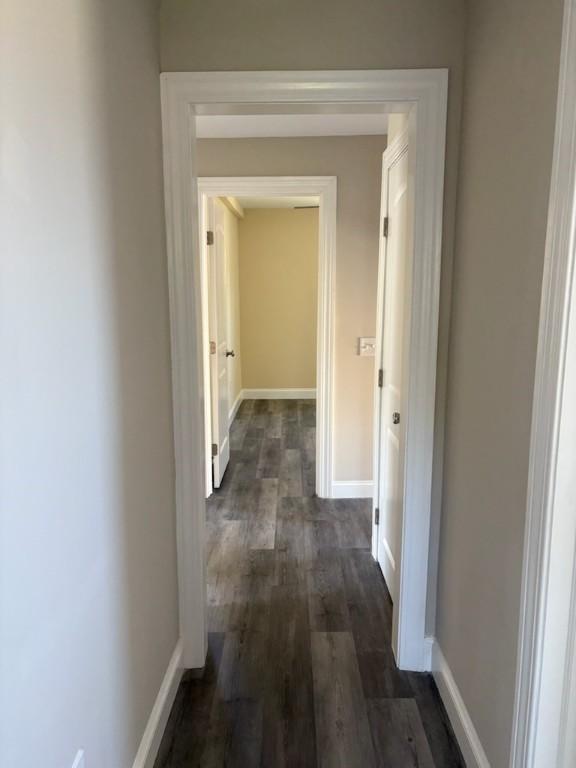 34 Sunnyside Dr, Elmira, NY 14905 - hallway featuring dark wood-style flooring and baseboards