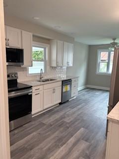 34 Sunnyside Dr, Elmira, NY 14905 - kitchen featuring electric stove, dishwasher, healthy amount of natural light, and a sink