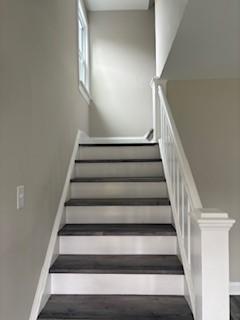 34 Sunnyside Dr, Elmira, NY 14905 - stairs with baseboards and wood finished floors