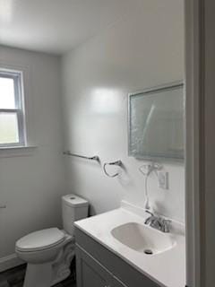 34 Sunnyside Dr, Elmira, NY 14905 - bathroom featuring vanity, toilet, and baseboards