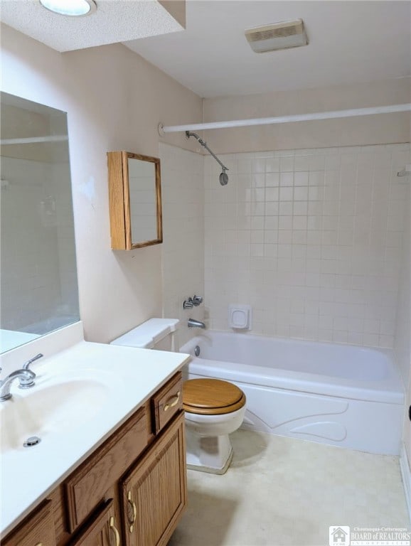 bathroom with toilet, bathtub / shower combination, and vanity