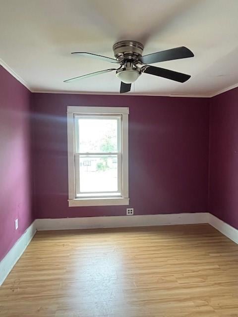 203 Church St, Catharine, NY 14869 - spare room featuring ornamental molding, baseboards, light wood finished floors, and ceiling fan