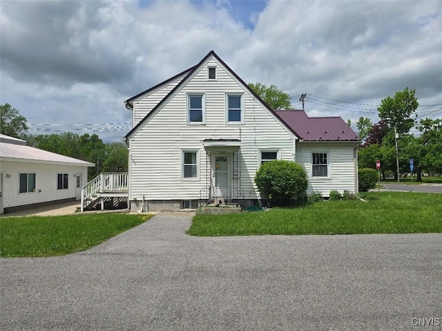 343 N Peterboro St, Lenox, NY 13032 - view of front of home with a front lawn and metal roof