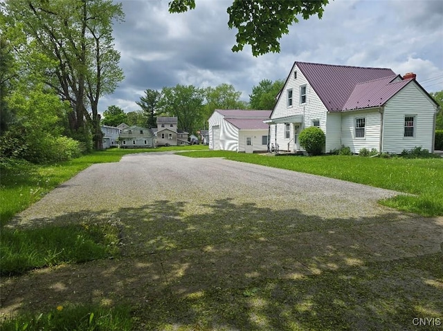343 N Peterboro St, Lenox, NY 13032 - view of side of home with metal roof and a lawn