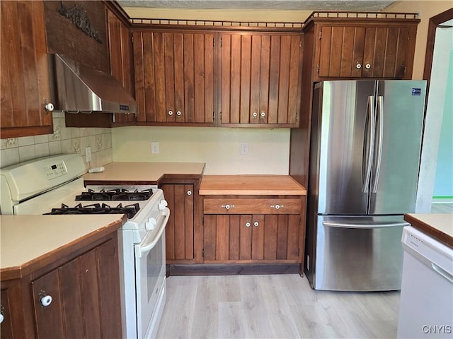 343 N Peterboro St, Lenox, NY 13032 - kitchen featuring white appliances, extractor fan, light countertops, and light wood-type flooring