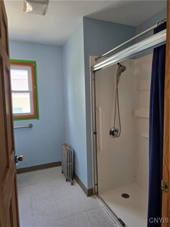 343 N Peterboro St, Lenox, NY 13032 - bathroom featuring radiator heating unit, a shower stall, and baseboards