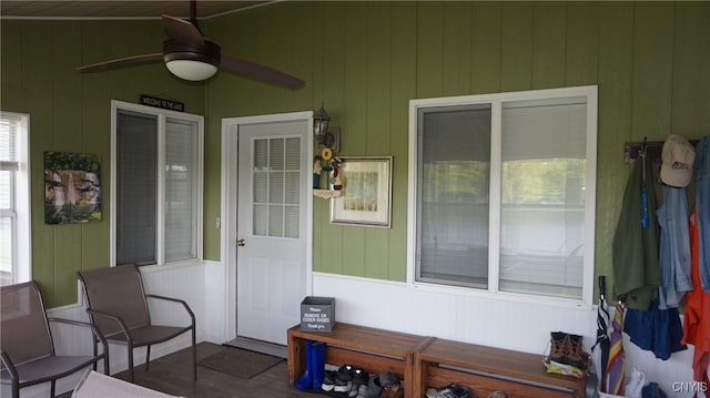 entrance to property with a ceiling fan