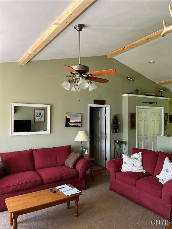 carpeted living room featuring ceiling fan