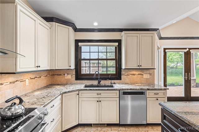 kitchen with stainless steel appliances, a sink, light stone countertops, backsplash, and recessed lighting