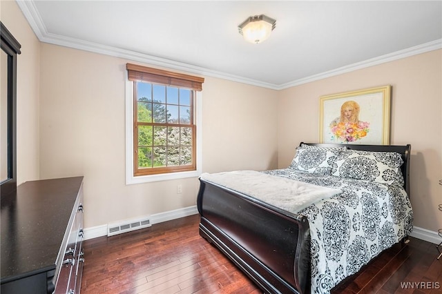 bedroom featuring wood-type flooring, baseboards, and ornamental molding