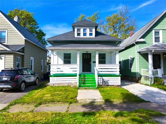 145 Heath St, Buffalo, NY 14214 - view of front of property with covered porch and roof with shingles