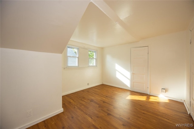 145 Heath St, Buffalo, NY 14214 - bonus room featuring wood finished floors, vaulted ceiling, and baseboards