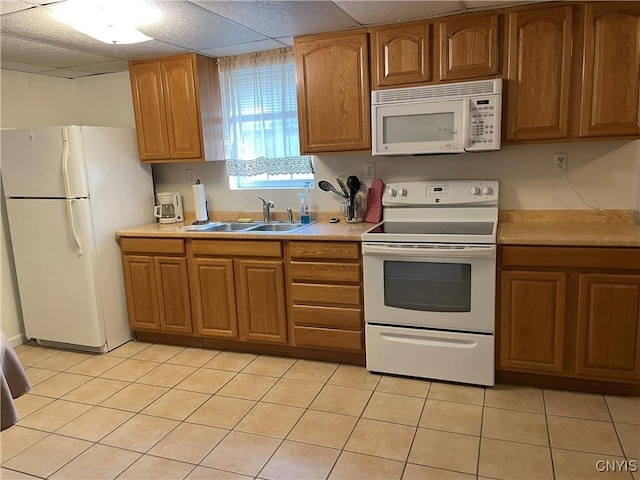 5180 Jamesville Rd, Dewitt, NY 13078 - kitchen with white appliances, a sink, light countertops, and brown cabinetry