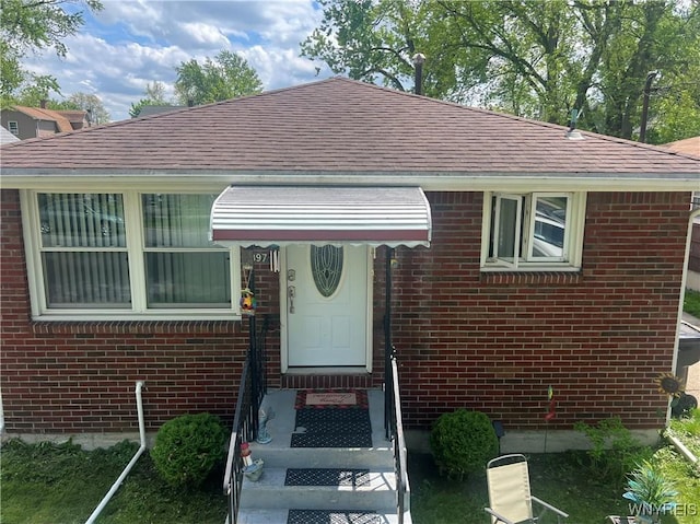 397 Broad St, Tonawanda-City, NY 14150 - view of front facade featuring brick siding and a shingled roof