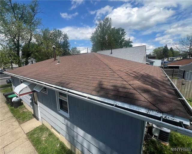 397 Broad St, Tonawanda-City, NY 14150 - exterior view of a shingled roof, fence, and central AC