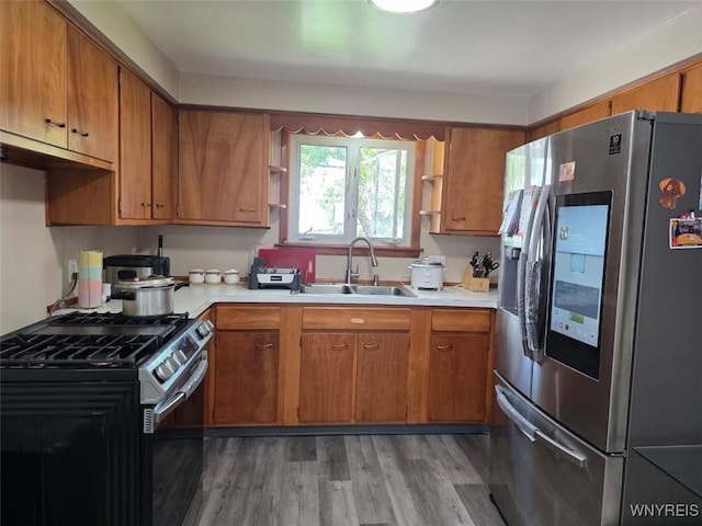 397 Broad St, Tonawanda-City, NY 14150 - kitchen featuring stainless steel appliances, a sink, open shelves, and brown cabinets