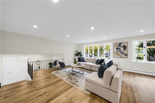 425 W Ln, Lewiston, NY 14092 - living area with healthy amount of natural light, light wood finished floors, a baseboard radiator, and recessed lighting