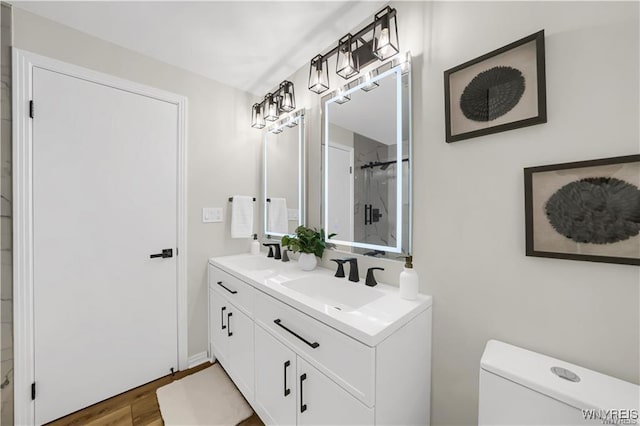 425 W Ln, Lewiston, NY 14092 - bathroom featuring wood finished floors, an enclosed shower, toilet, and double vanity