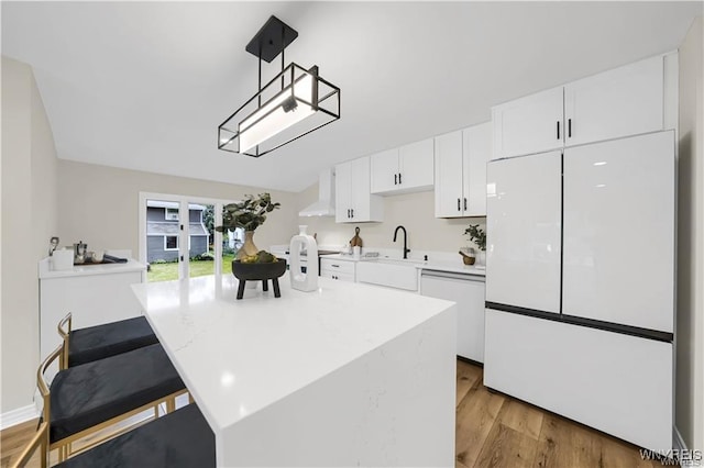 425 W Ln, Lewiston, NY 14092 - kitchen featuring white appliances, a sink, wall chimney range hood, white cabinets, and light countertops