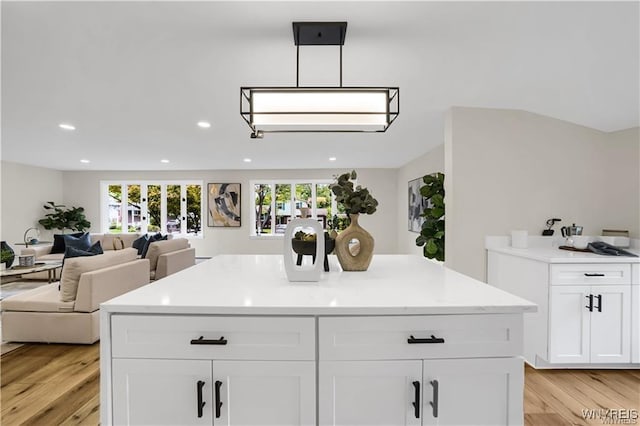 425 W Ln, Lewiston, NY 14092 - kitchen with light wood-type flooring, open floor plan, recessed lighting, white cabinets, and light countertops