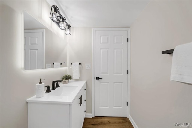425 W Ln, Lewiston, NY 14092 - bathroom featuring wood finished floors, vanity, and baseboards
