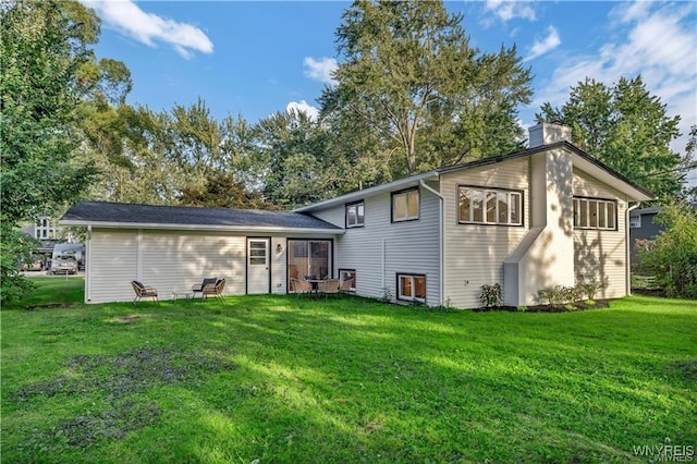 425 W Ln, Lewiston, NY 14092 - back of property with a chimney and a lawn