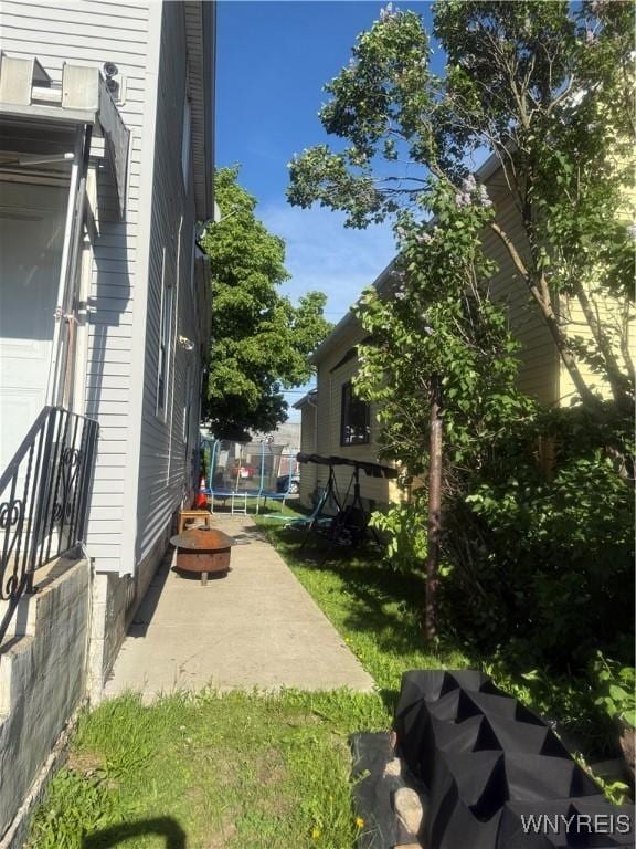30 Woodell Ave, Cheektowaga, NY 14211 - view of side of property featuring a trampoline and a patio