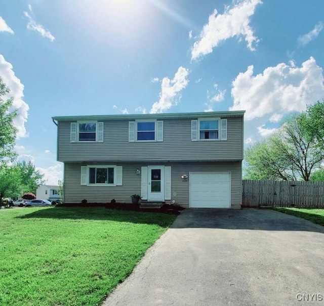 view of front of property featuring driveway and an attached garage
