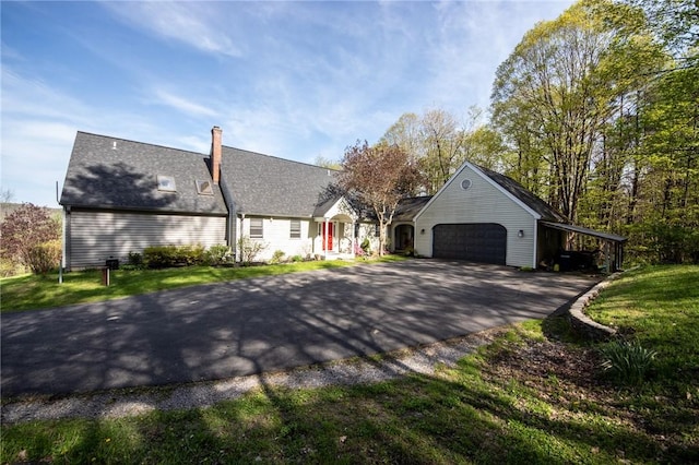 1177 County Highway 26, Otsego, NY 13337 - view of front facade featuring driveway, an attached garage, a front lawn, and a chimney