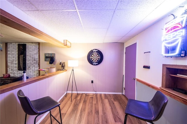 1177 County Highway 26, Otsego, NY 13337 - bar featuring a paneled ceiling, wood finished floors, and baseboards