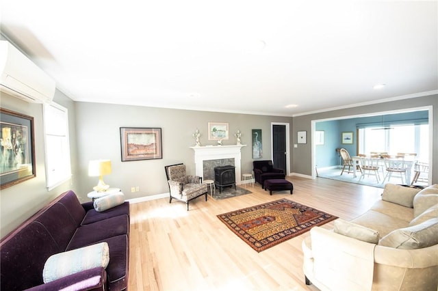 1177 County Highway 26, Otsego, NY 13337 - living room with wood finished floors, a wall mounted AC, plenty of natural light, crown molding, and baseboards