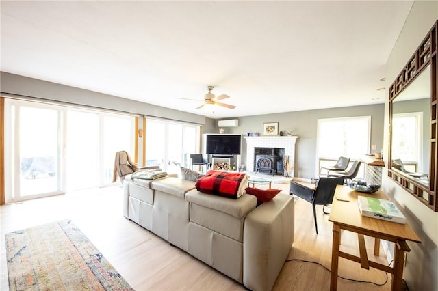 1177 County Highway 26, Otsego, NY 13337 - living room featuring ceiling fan, light wood-type flooring, and a fireplace