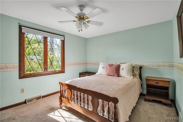 bedroom with carpet floors, baseboards, and a ceiling fan