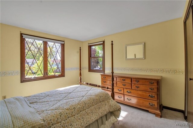 bedroom featuring light carpet