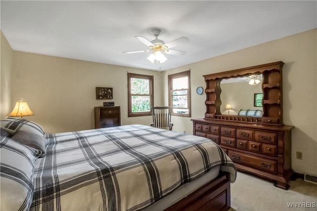 carpeted bedroom featuring ceiling fan