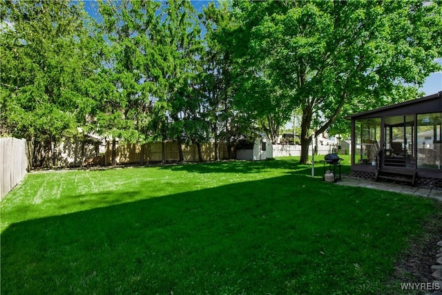 view of yard featuring a shed and an outbuilding