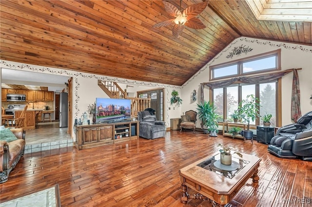 9811 Deer Creek Rd, Genesee, NY 14770 - living room featuring wooden ceiling, stairs, high vaulted ceiling, hardwood / wood-style floors, and a ceiling fan