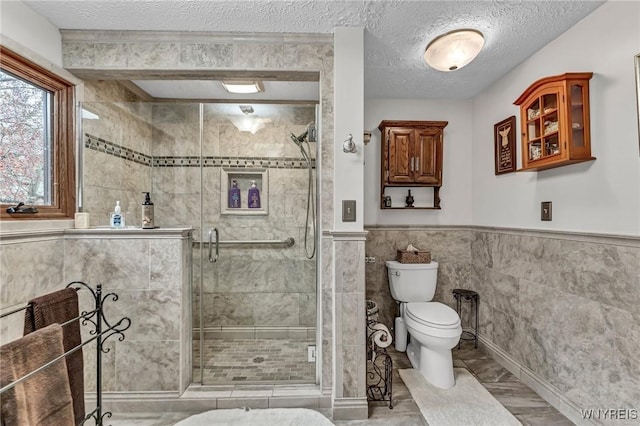 9811 Deer Creek Rd, Genesee, NY 14770 - full bathroom featuring toilet, a shower stall, tile walls, wainscoting, and a textured ceiling