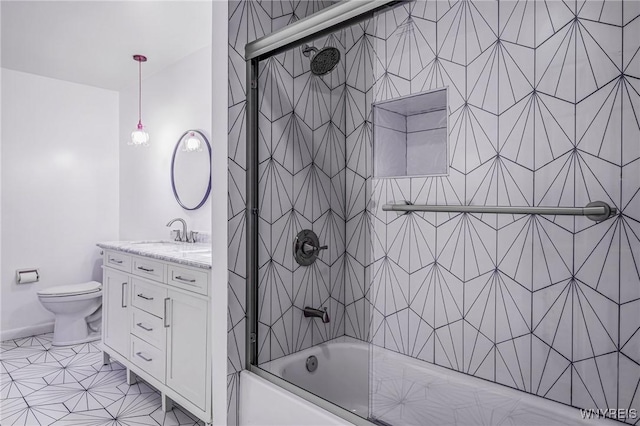bathroom with toilet, vanity, combined bath / shower with glass door, and tile patterned floors