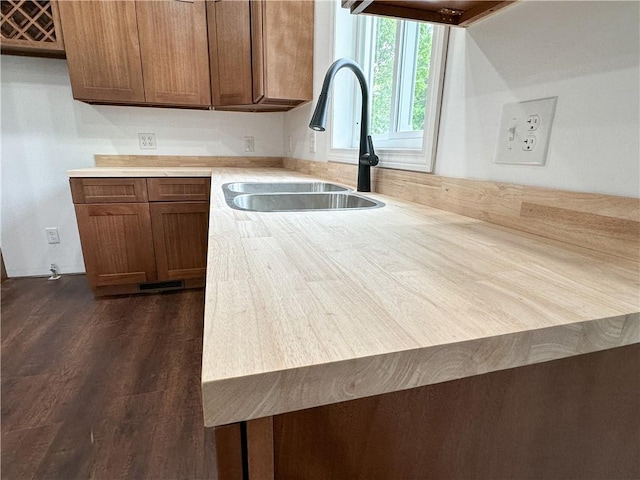 258 Mcmaster St, Bath, NY 14810 - kitchen featuring light countertops, brown cabinets, a peninsula, and dark wood-type flooring