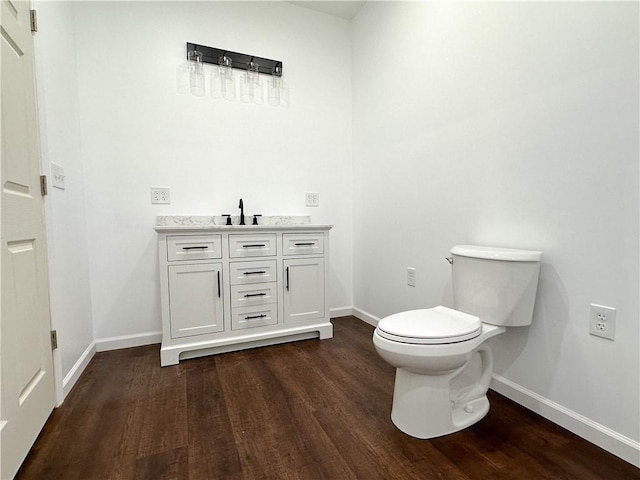258 Mcmaster St, Bath, NY 14810 - bathroom featuring baseboards, wood finished floors, and toilet