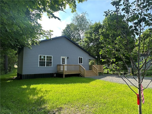 258 Mcmaster St, Bath, NY 14810 - rear view of property with a wooden deck and a lawn