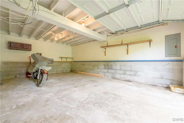 garage with electric panel and concrete block wall