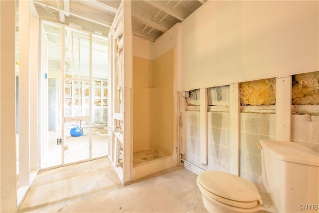 full bath featuring toilet and a stall shower